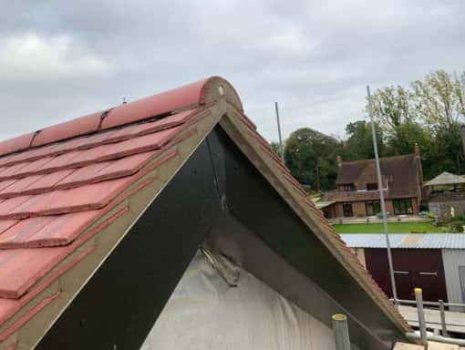 This is a photo of a gable end roof re-tiled in Tenterden, Kent. All works carried out by Tenterden Roofers